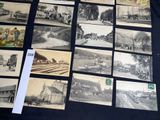 a lot of old black and white photos on the table