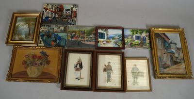 many framed pictures on the wall of this room