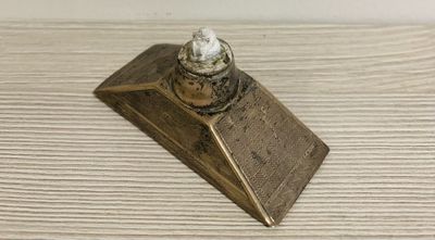 a small metal object that is on a table
