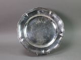 a silver plate that is sitting on a table