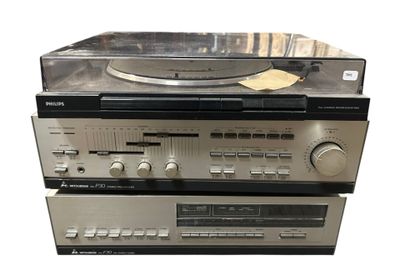 two stereo systems are stacked on top of each other on a white surface