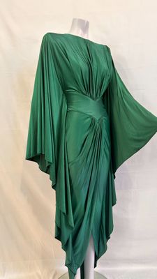 an image of a green dress on a mannequin