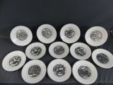 six plates with black and white designs on them on a table
