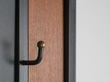 a close up of a door handle on a wooden door