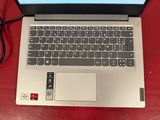 an open laptop computer sitting on top of a red table