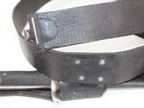 a leather belt with a metal buckle on it
