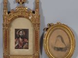 two framed pictures of a man and a woman with a cross