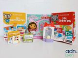many children ' s books and toys on the table