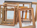 a lot of picture frames sitting on a table