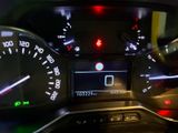 the dashboard of a car with a digital display on it