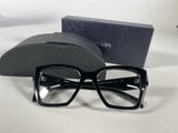 glasses are sitting on a white surface next to a black case