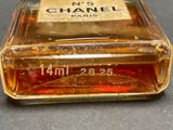a bottle of chanel perfume on a table