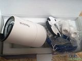 a white box with a white camera inside of it