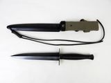 a knife and a knife sheath on a white surface