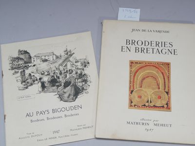 two books are sitting on a table next to each other