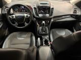 the interior of a car with a steering wheel, dashboard, and dashboard controls