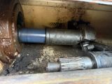 a close up of a metal pipe and a hose