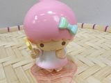 a little girl figurine that is sitting on a table