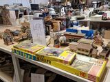 many boxes of toys on a table in a room