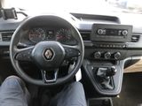 steering view of a car with a person sitting in the driver ' s seat