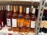 many bottles of wine on the shelf in the store