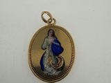 a close up of a gold locke with a blue and white image on it