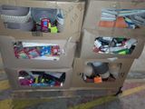 a carton with many items in it sitting on the floor
