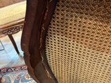 an image of a wooden chair with a wicker seat