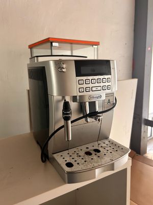 a coffee machine that is sitting on a shelf