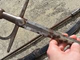 a person holding a pair of scissors in their hand