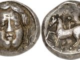 a silver coin with a woman and a horse on it