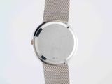 a close up of a wrist watch with a metal band