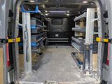 a van that has a lot of shelves in the back of it
