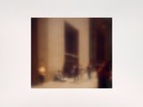 a blurry photo of a living room with a couch and coffee table
