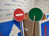 two signs that are next to each other in a room
