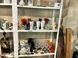 a shelf with a lot of glass items on it