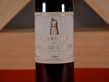 a bottle of wine that is sitting on a table
