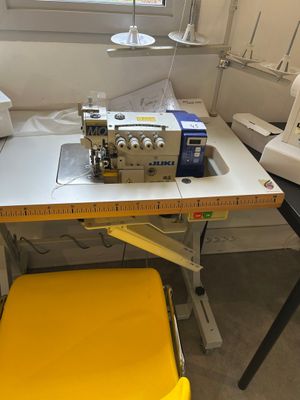 a sewing machine sitting on a table in a room