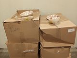 boxes stacked on top of each other on a pallet in a room
