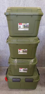 three green storage boxes stacked on top of each other