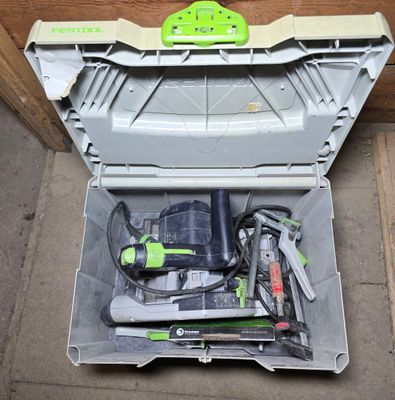 a tool box with tools inside of it on the floor