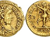 a gold coin with an image of a man holding a sword