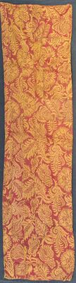 an orange and yellow cloth with a pattern on it on a blue surface