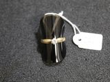 a ring that is sitting on top of a black object
