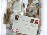 a plastic container filled with lots of stamps and postcards