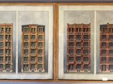 painting of a pair of buildings in a wooden frame on a wall