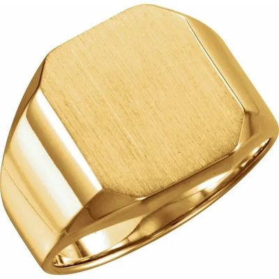 a close up of a gold signet ring on a white background