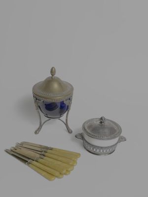 an image of a silver and blue candle holder and a set of matchesticks