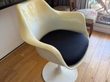 a chair that is sitting in front of a window