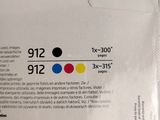 a black, yellow, red, and blue ink in a package